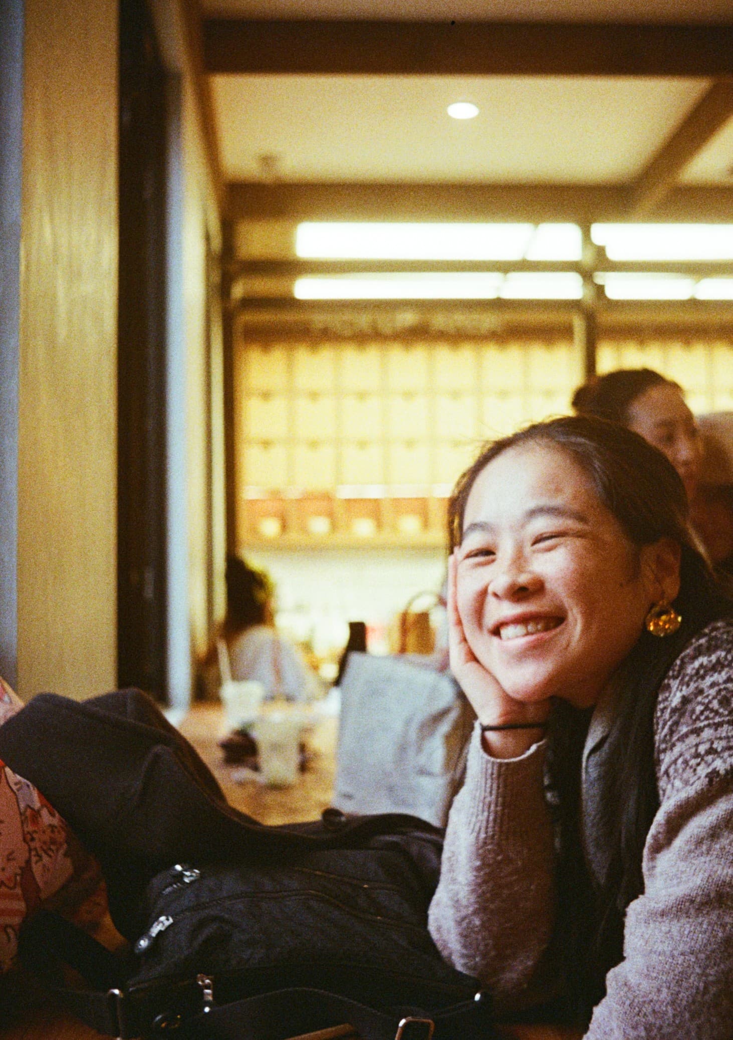 Elysée Ng smiling at a café table